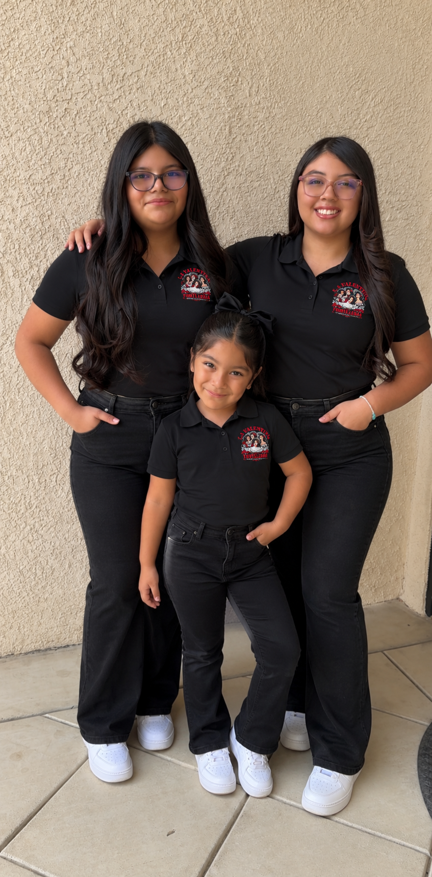 The three daughters of the La Valentina Tortilleria family wearing matching business polos